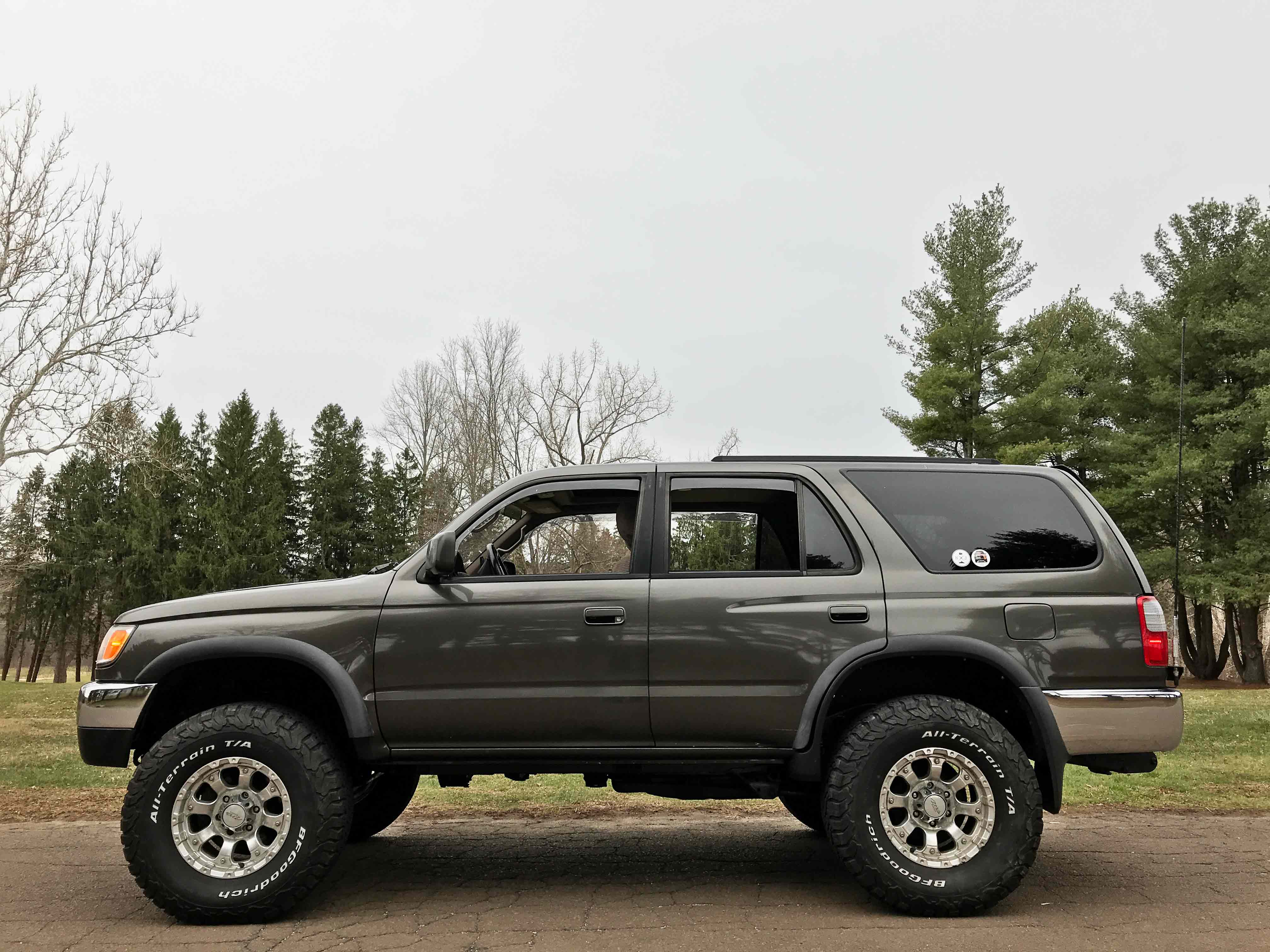 1998 Toyota 4Runner SR5 5 Speed 4x4 3.4L V6 Third Generation - The Holy Grail Third Gen : 3rd Gen with RECON: New Frame, Brakes Throughout, New Radiator, New A/C Condenser, New Steering Rack-Power Steering Hoses, New Sway Bar Links, New Cam Plugs, New Cat to back Exhaust System, New Cluch and Clutch Assembly, New Rear Manifold Seal, New Timing Belt and Waterpump, New Valve Cover Gaskets, New Belts, New Gas Tank, New 3" Bilstein Lift Kit, New Toytech Rear BOSS Shocks, 4 New 285-75-16 BF Goodrich All Terrain Tires, New MB Wheels, New Upgraded JVC Digital Media and Sound system — hero